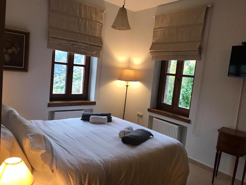 Postel nebo postele na pokoji v ubytování Methexis Boutique Hotel
