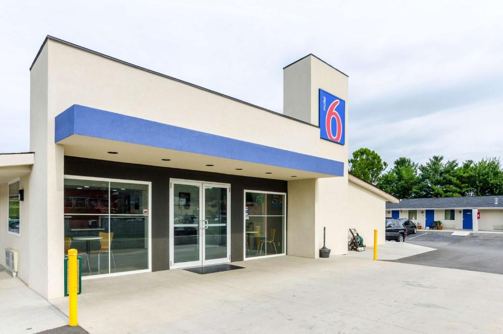 a gas station with a sign on the side of it at Motel 6-Troutville, VA in Troutville