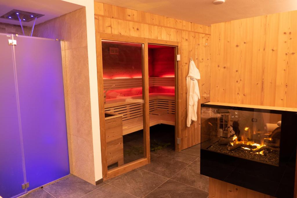 a bathroom with a room with a bunk bed at Villa Artic Apartments in Campitello di Fassa