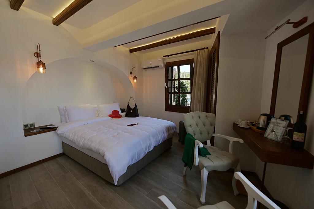 Postel nebo postele na pokoji v ubytování Mets Boutique Hotel
