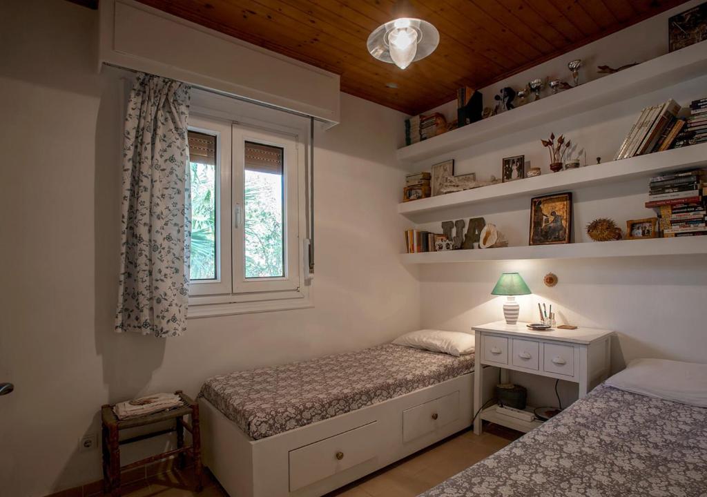 Postel nebo postele na pokoji v ubytování Marathos beach House