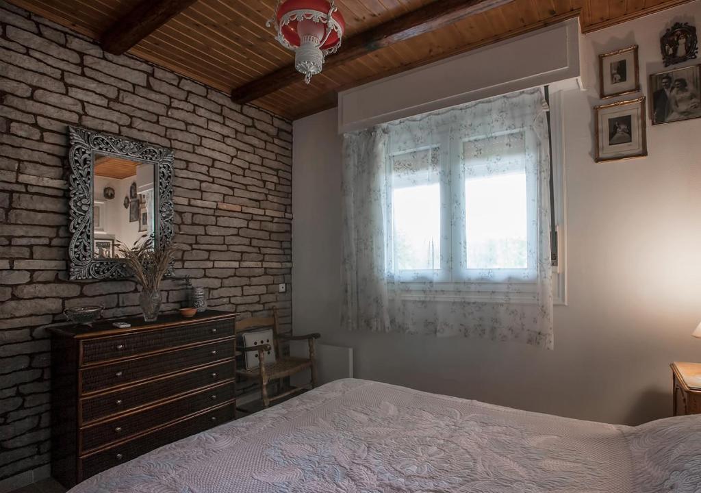 Postel nebo postele na pokoji v ubytování Marathos beach House