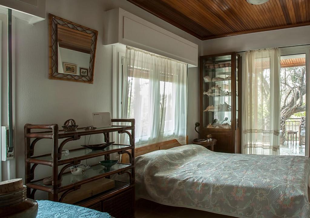 Postel nebo postele na pokoji v ubytování Marathos beach House