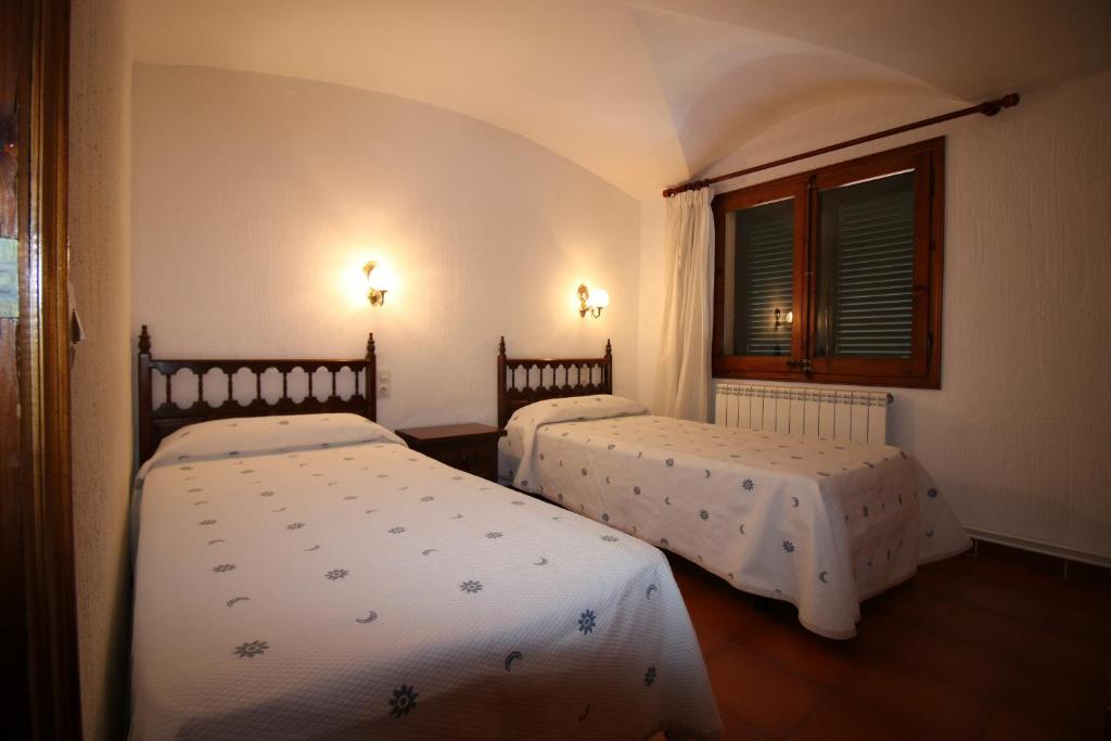 Postel nebo postele na pokoji v ubytování Casa la Borna