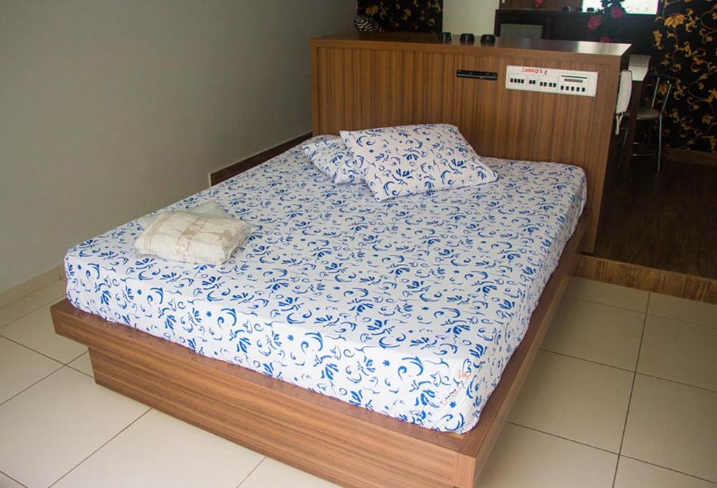Postel nebo postele na pokoji v ubytování Hotel Zarkos