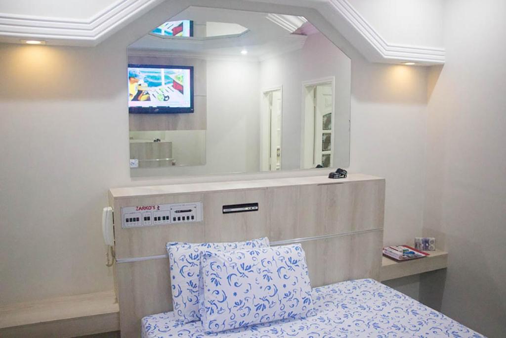 Postel nebo postele na pokoji v ubytování Hotel Zarkos