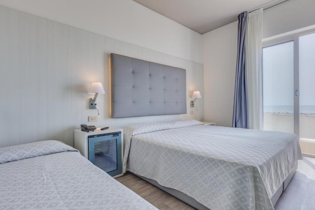 Postel nebo postele na pokoji v ubytování Hotel Austria