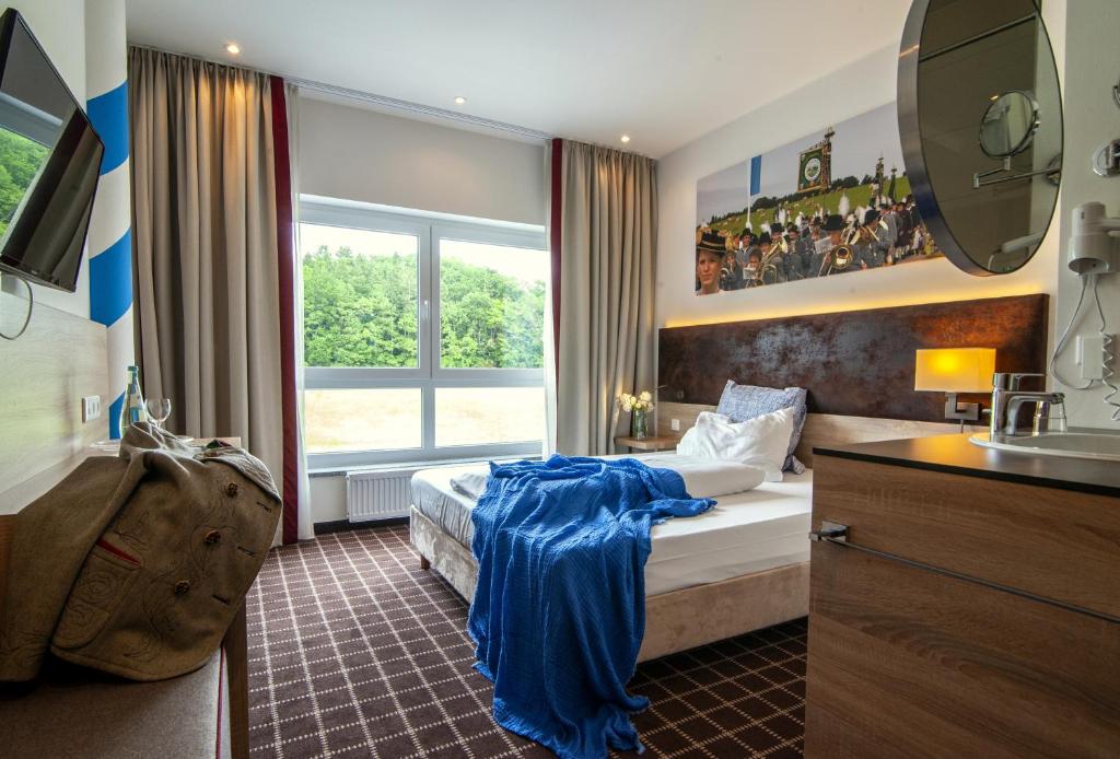 Postel nebo postele na pokoji v ubytování Business Class Hotel Ebersberg