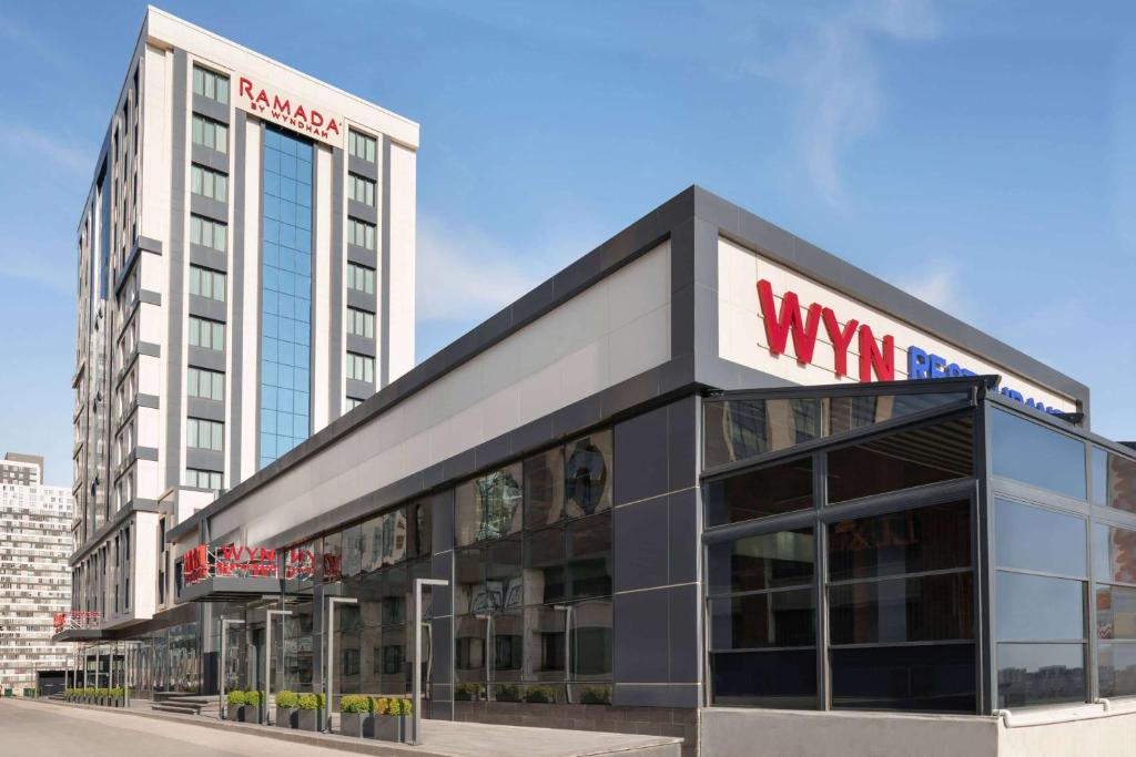 a building with a wii sign on top of it at Ramada Beylikduzu in Istanbul