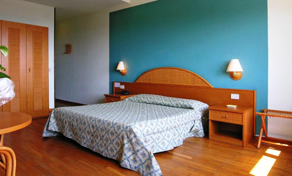 Postel nebo postele na pokoji v ubytování Hotel Cavalieri