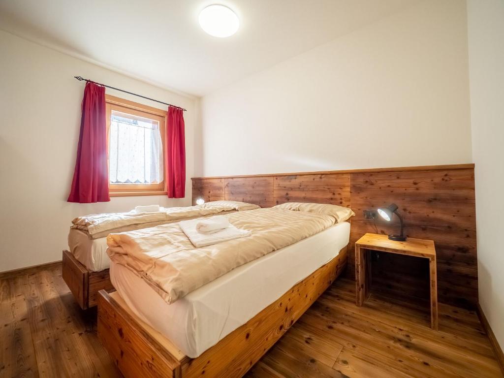 Łóżko lub łóżka w pokoju w obiekcie Apartments & Rooms MyHolidayLivigno