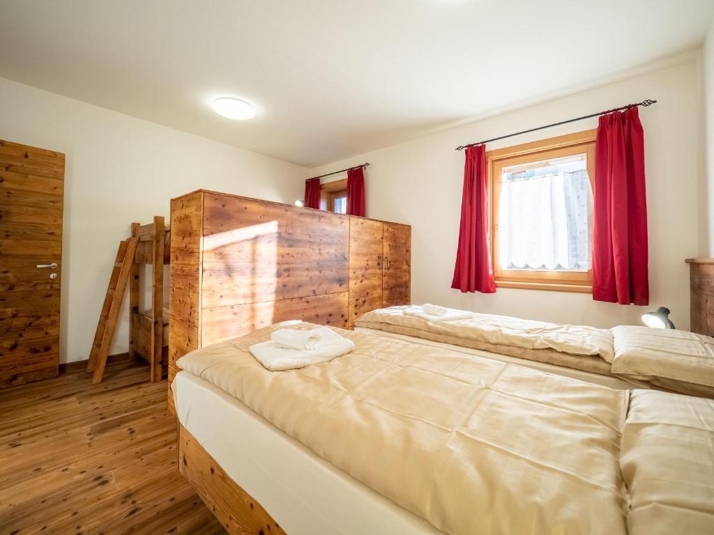 Łóżko lub łóżka w pokoju w obiekcie Apartments & Rooms MyHolidayLivigno