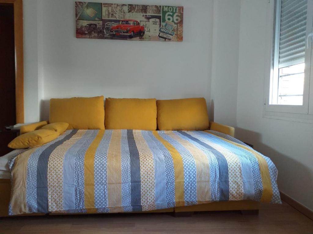 Postel nebo postele na pokoji v ubytování Ílios Soho Apartamentos