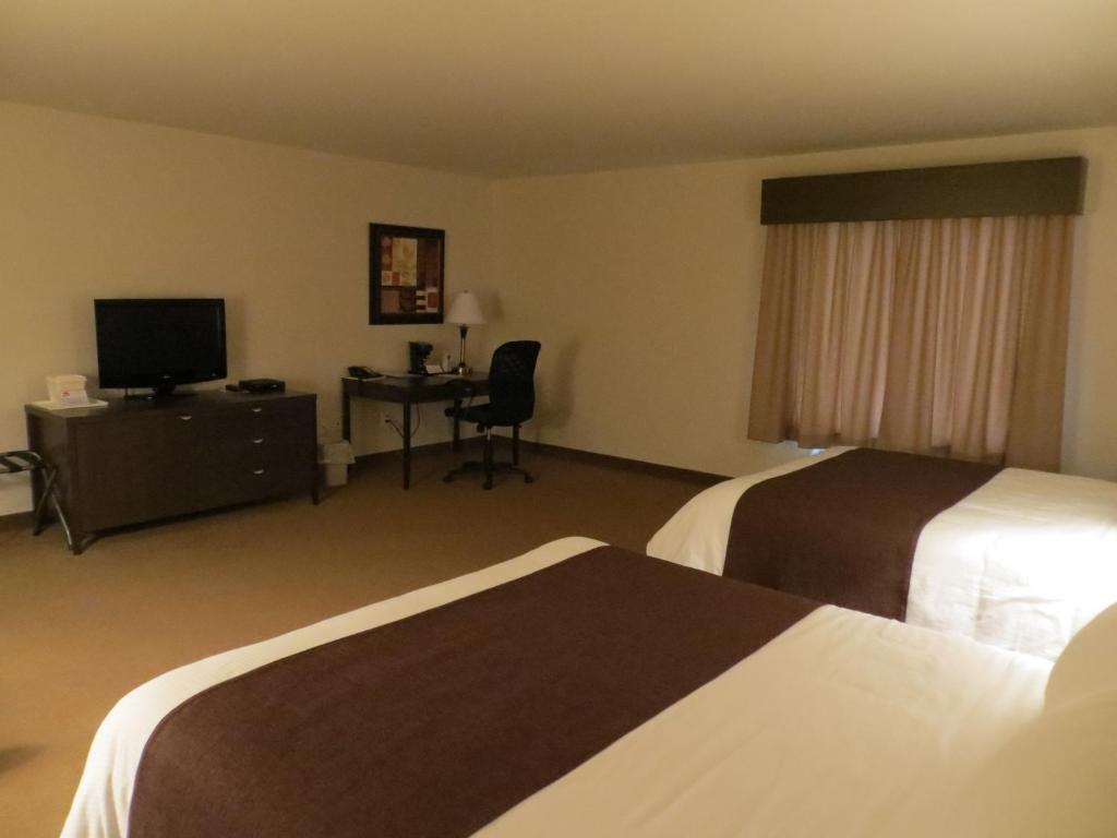 Postel nebo postele na pokoji v ubytování Villegiature Deux Rivieres Resort