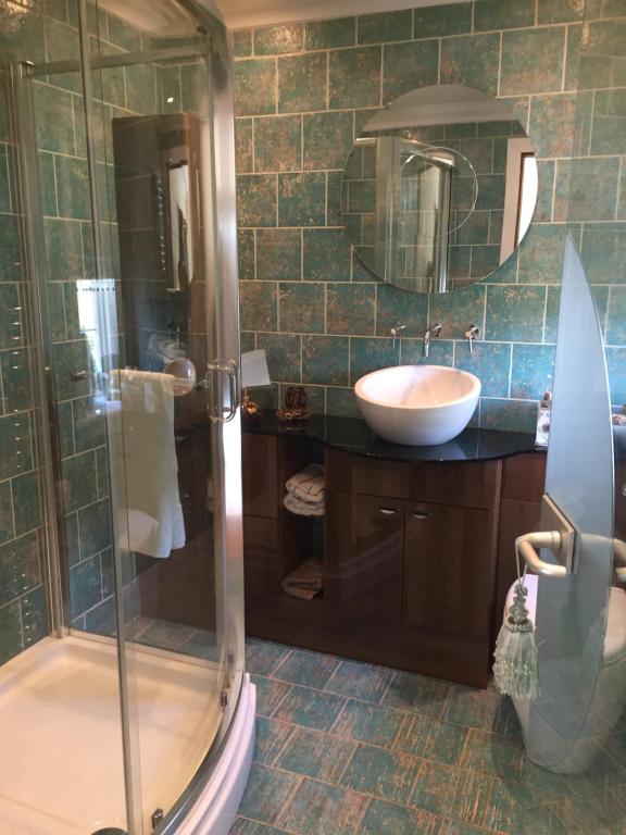 a bathroom with a sink, toilet and shower at Retreat at The Knowe Auchincruive Estate in Ayr