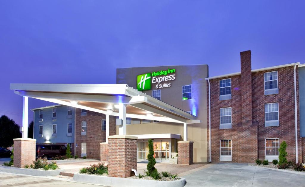 a front view of a hotel with a gas station at Holiday Inn Express Hotel & Suites North Kansas City, an IHG Hotel in Kansas City