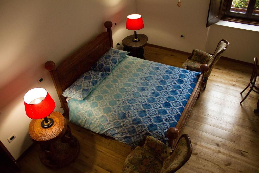 Postel nebo postele na pokoji v ubytování B&B BONE NOVELLE dimora storica palazzo zuzi