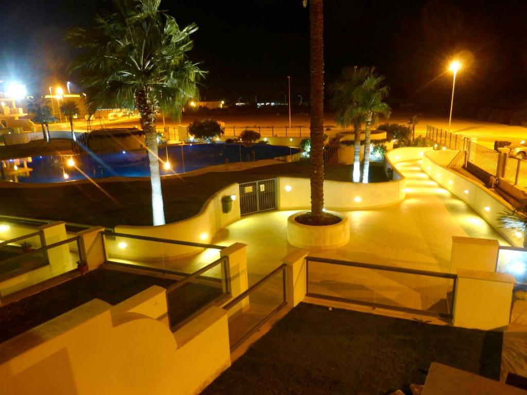 a skate park at night with palm trees and lights at Casa Valdevaqueros in Tarifa