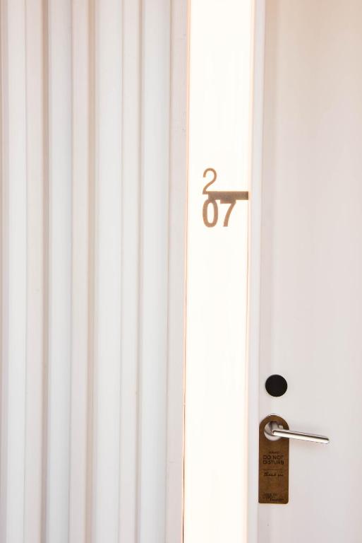 a door with a number on it next to a window at Aroeira Lisbon Hotel - Sea & Golf in Aroeira