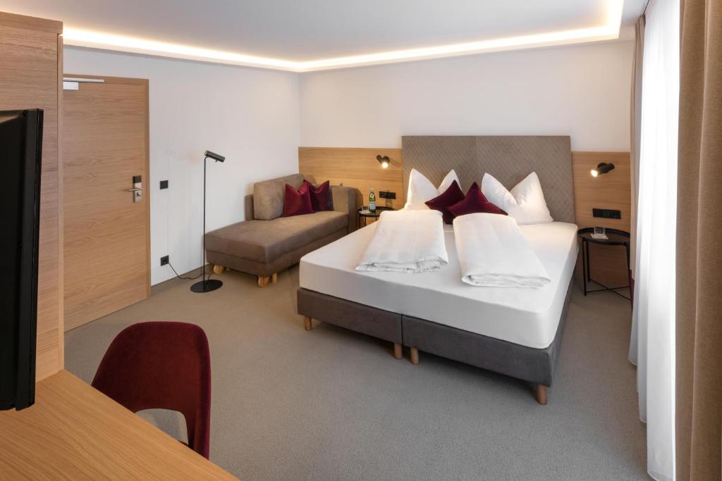 Postel nebo postele na pokoji v ubytování Hotel Hennersberg