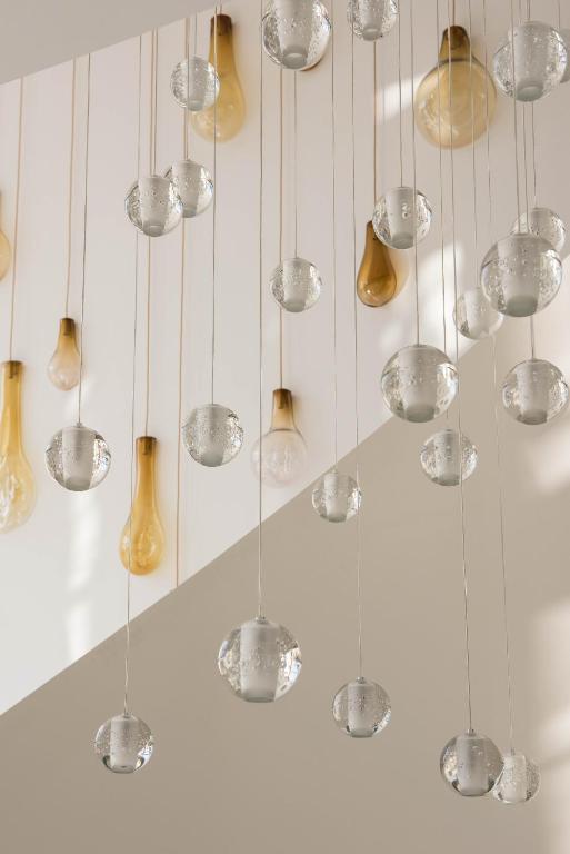 a bunch of glass balls hanging from a ceiling at Aroeira Lisbon Hotel - Sea & Golf in Aroeira