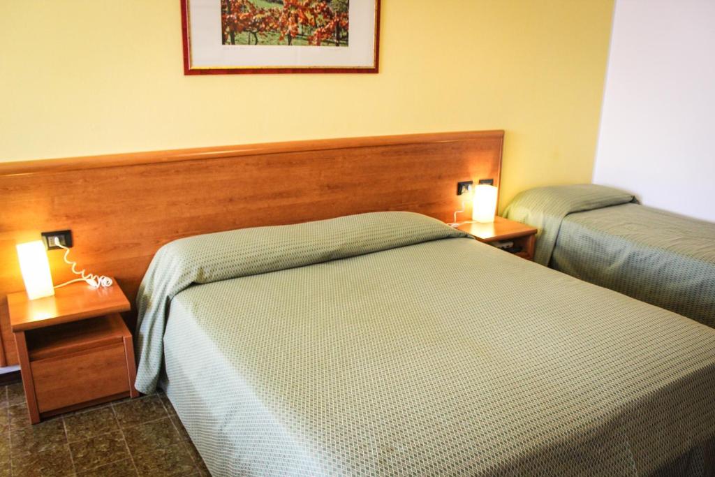 Postel nebo postele na pokoji v ubytování Hotel Centrale