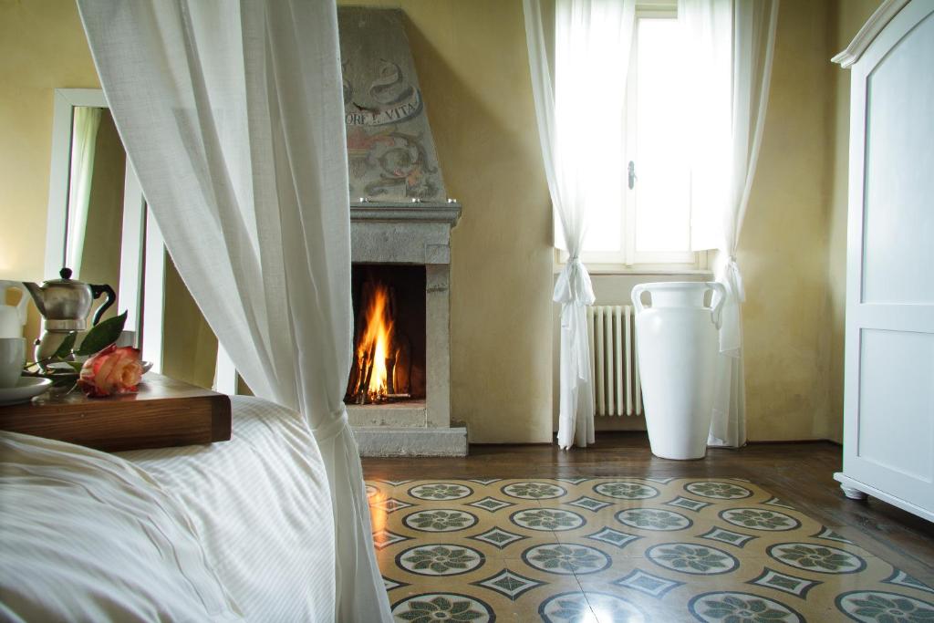 Postel nebo postele na pokoji v ubytování Villa Cassia di Baccano