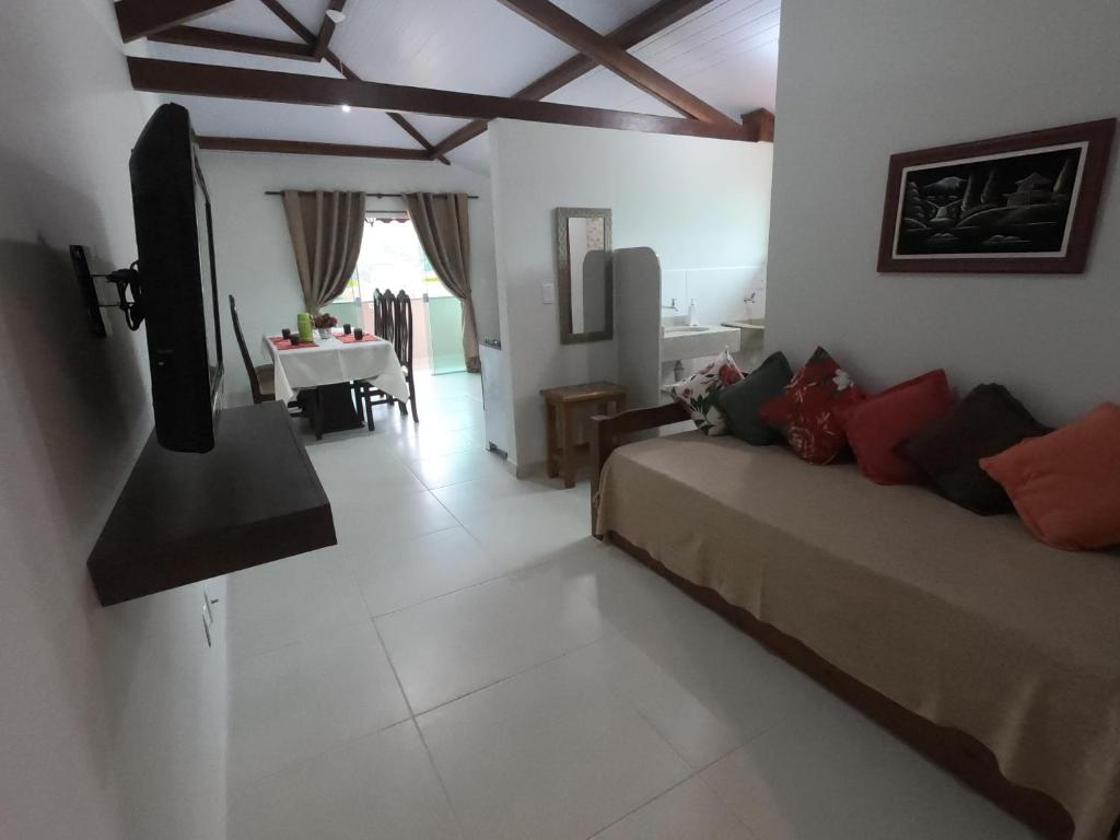 TV a/nebo společenská místnost v ubytování Recanto Guarassol Apartamentos