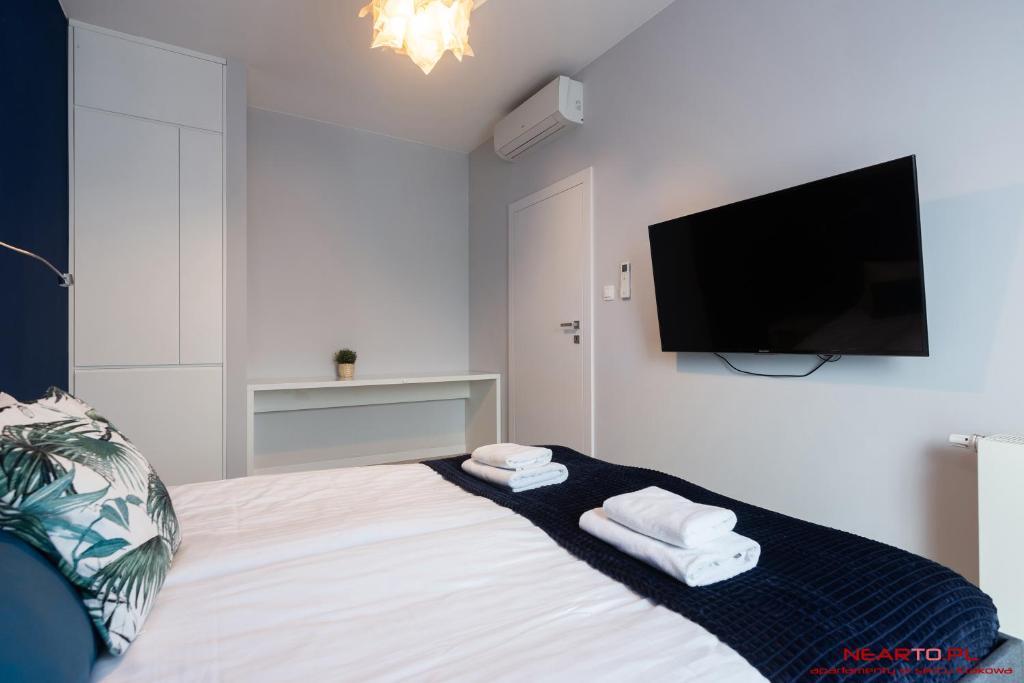 Televízia a/alebo spoločenská miestnosť v ubytovaní Apartments Nearto Old Town Rakowicka