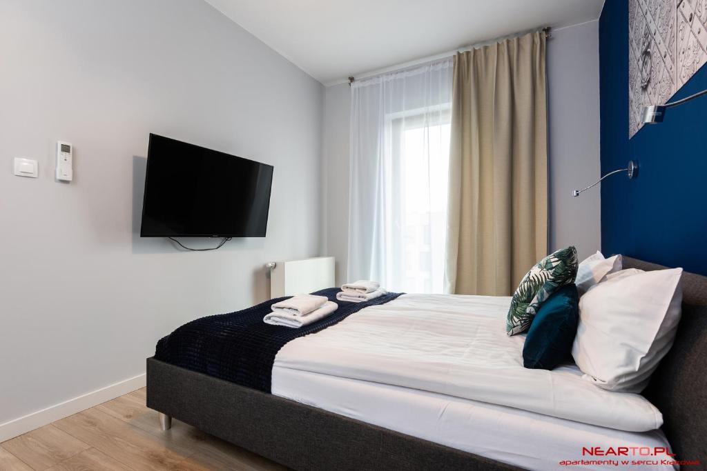 Posteľ alebo postele v izbe v ubytovaní Apartments Nearto Old Town Rakowicka