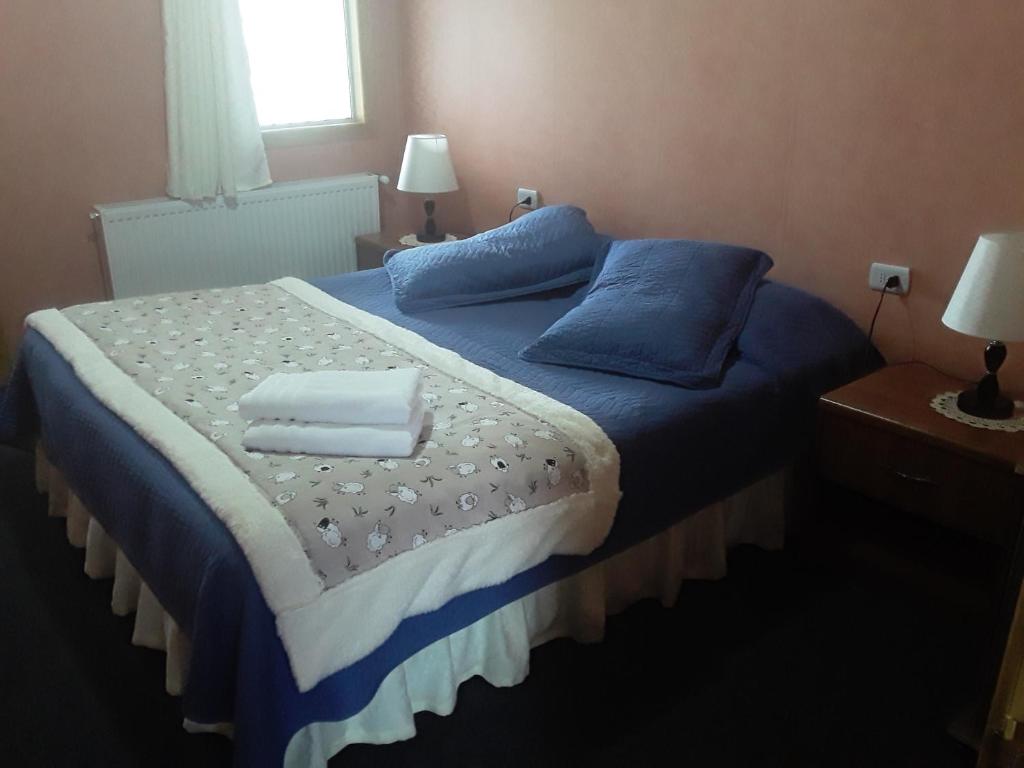 Postel nebo postele na pokoji v ubytování Hostal Don Pedro