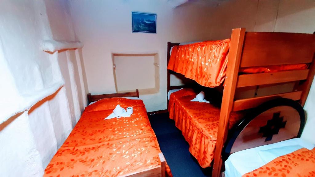 Postel nebo postele na pokoji v ubytování Hostal sambleño cusco Piero suite