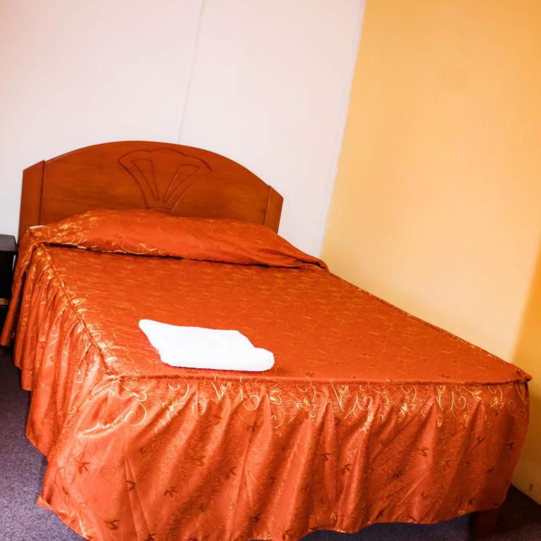 Postel nebo postele na pokoji v ubytování Hostal sambleño cusco Piero suite