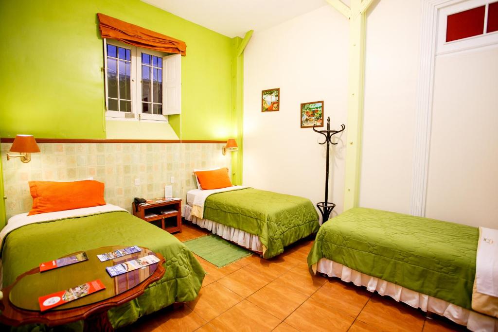 Cama o camas de una habitación en Lima Wari Hotel Boutique
