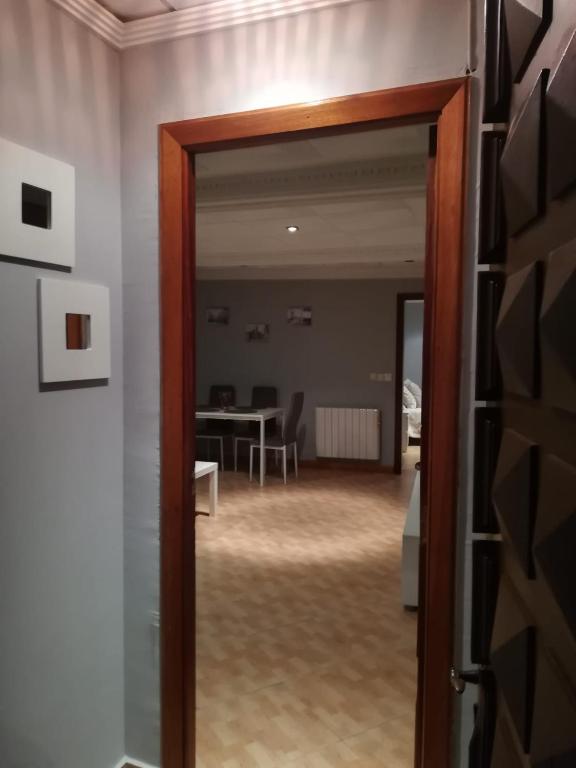 a door leading into a room with a dining room at Casa De Paz in Zamora
