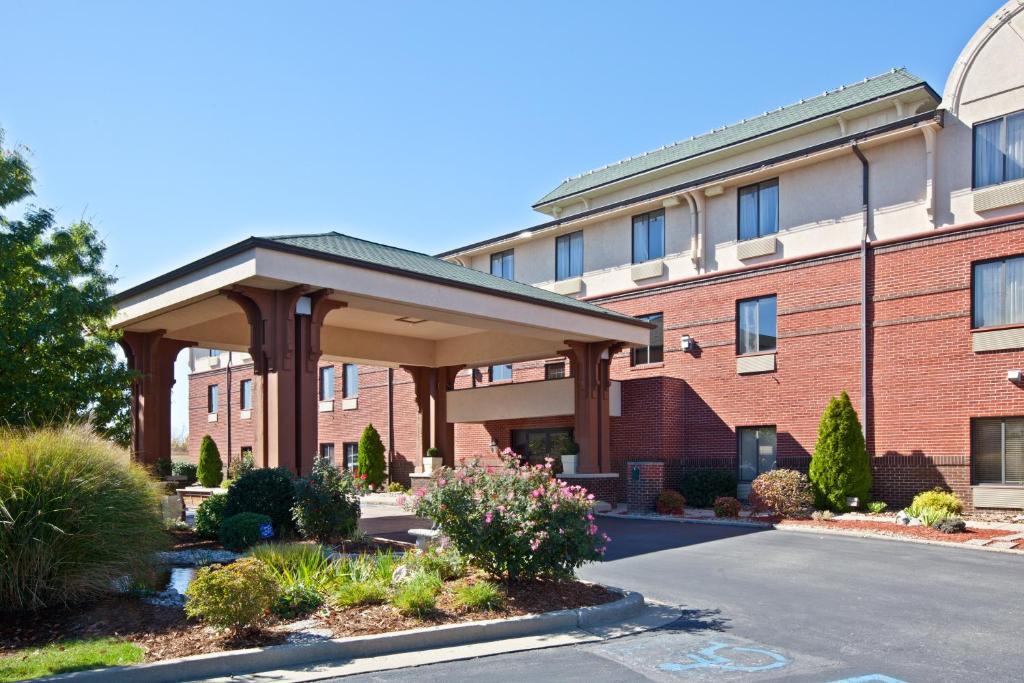 a building with a pavilion in front of a building at Holiday Inn Express Corydon by IHG in Corydon