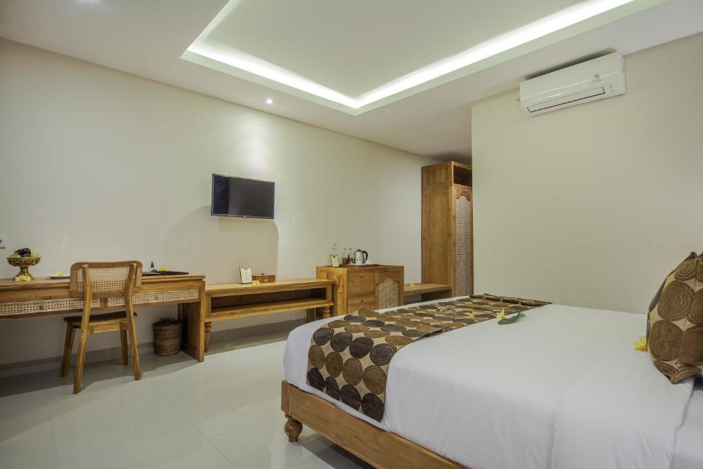 A bed or beds in a room at Bubu Suite by Prasi