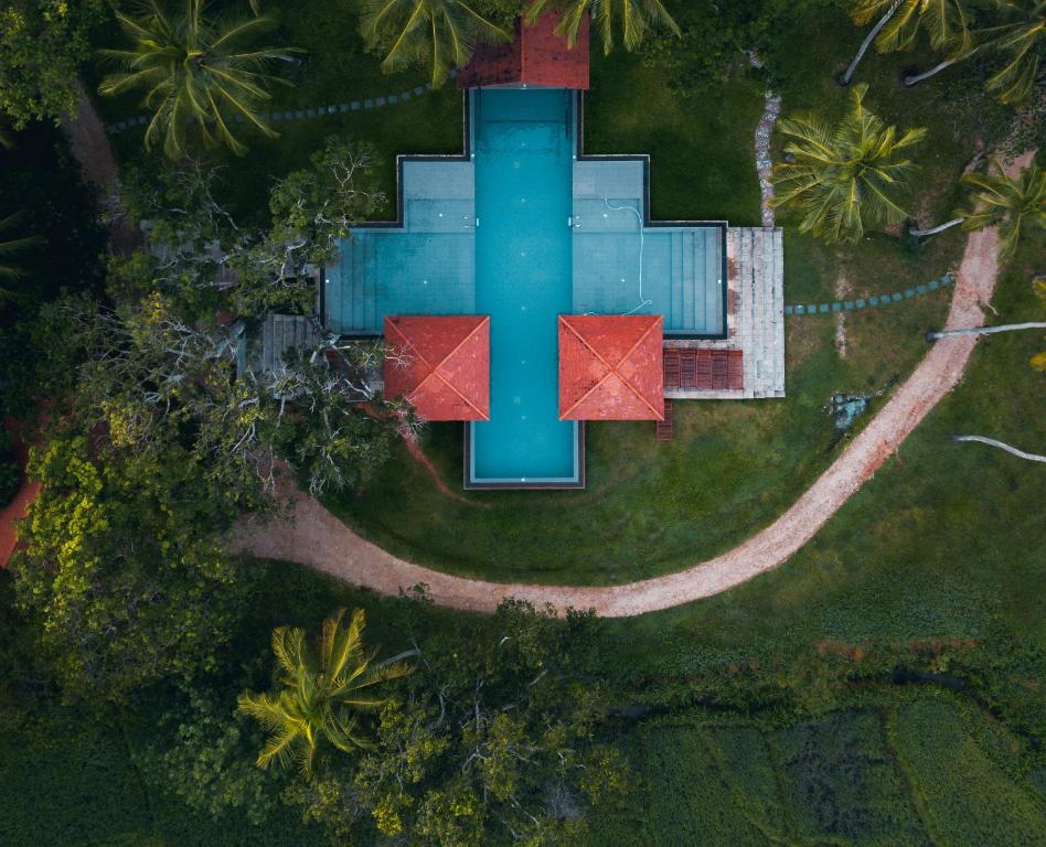 an aerial view of a house with a swimming pool at Jetwing Kaduruketha in Wellawaya