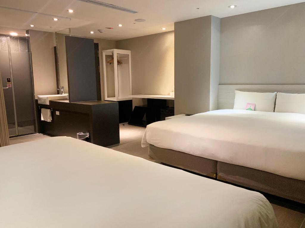 Postel nebo postele na pokoji v ubytování Wholesome Hotel