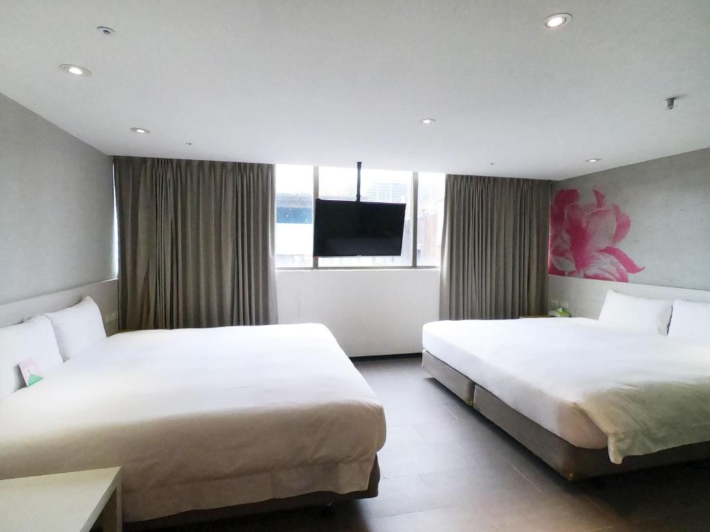 Postel nebo postele na pokoji v ubytování Wholesome Hotel