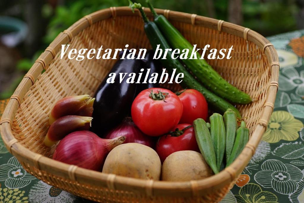 a basket of vegetables on a table with the words vegetarian breakfast available at AbbeyRoad Inn Seika in Seika
