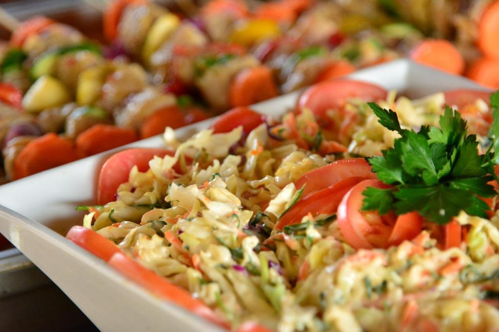 a tray of food with tomatoes and other vegetables at Bayala Private Safari Lodges in Hluhluwe