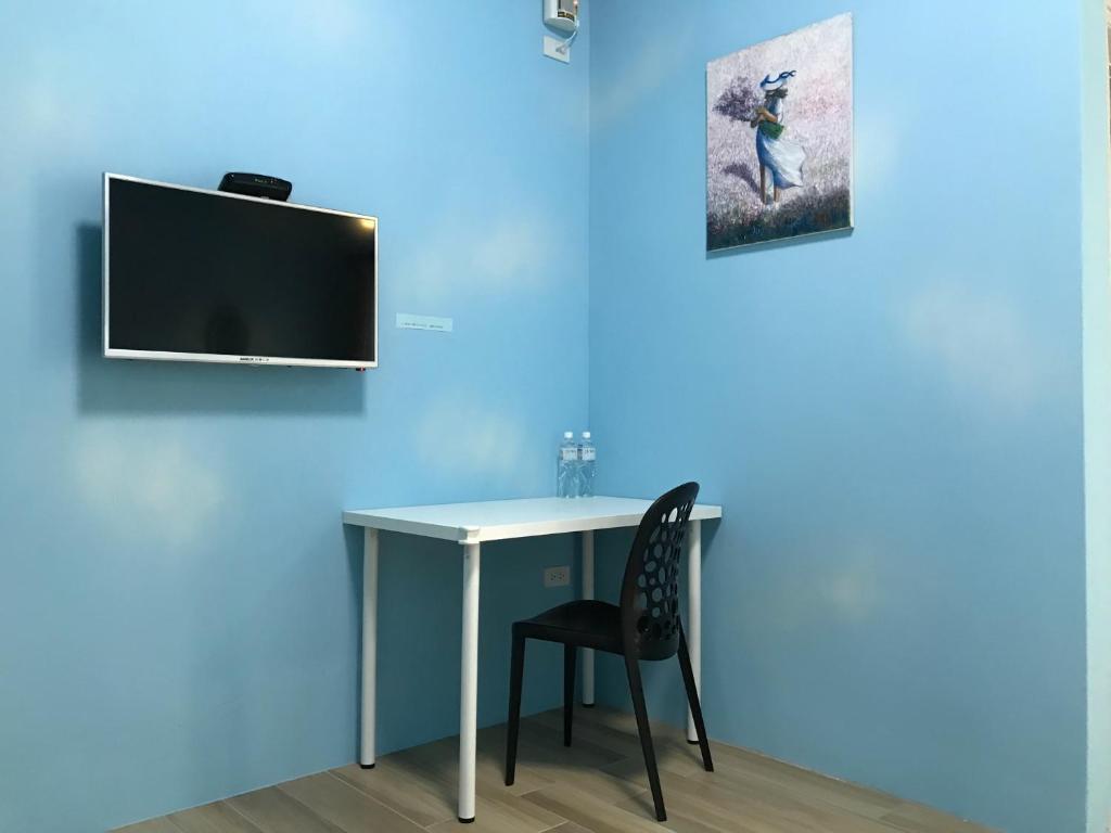 TV a/nebo společenská místnost v ubytování JOY Homestay