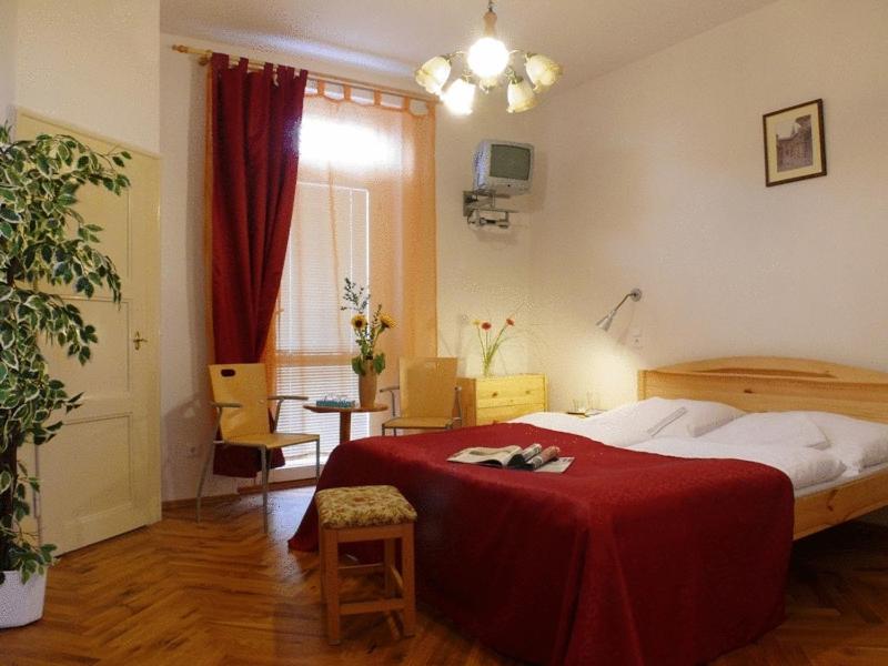 Postel nebo postele na pokoji v ubytování Pension Prague City