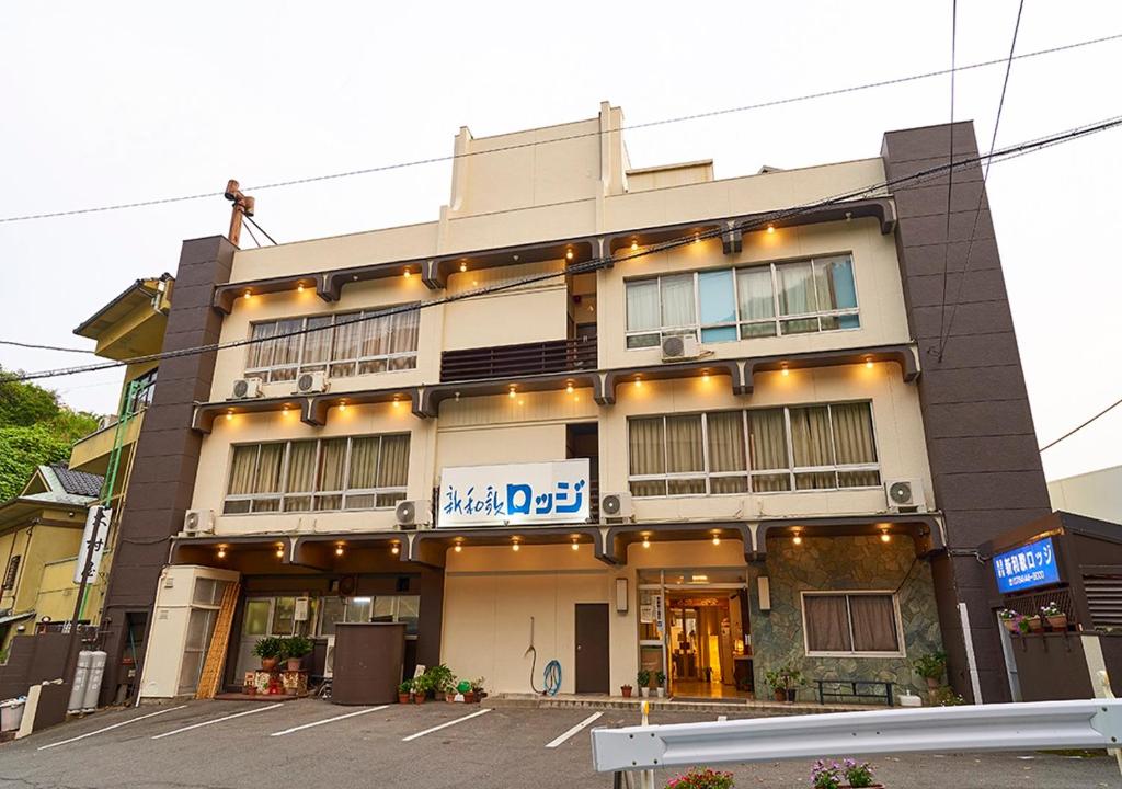 a building with lights on the front of it at Shinwaka Lodge in Wakayama