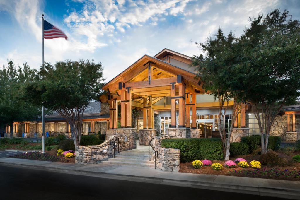 a building with an american flag in front of it at Crowne Plaza Resort Asheville, an IHG Hotel in Asheville