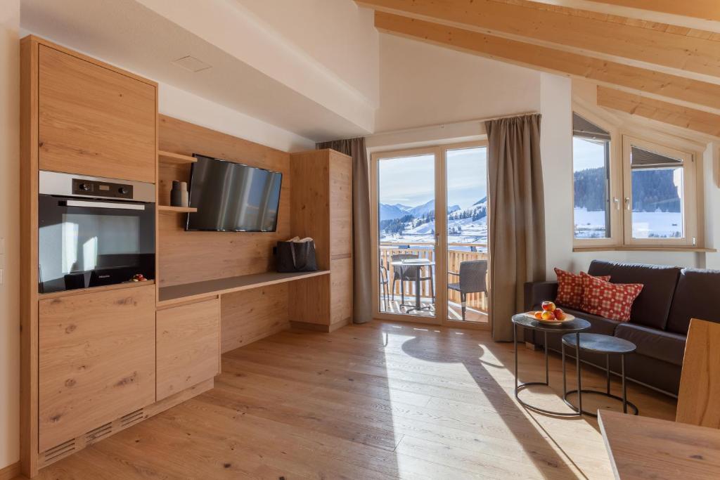Televízia a/alebo spoločenská miestnosť v ubytovaní Apart-Hotel Dreisonnenhof