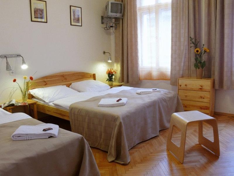 Postel nebo postele na pokoji v ubytování Pension Prague City