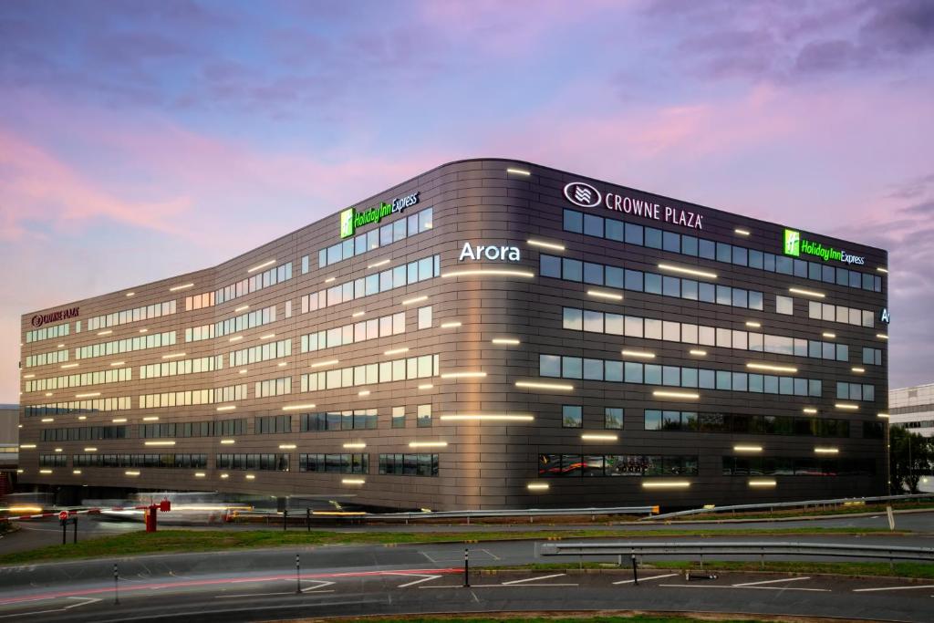 a building with a sign on the side of it at Crowne Plaza London Heathrow T4, an IHG Hotel in Hillingdon