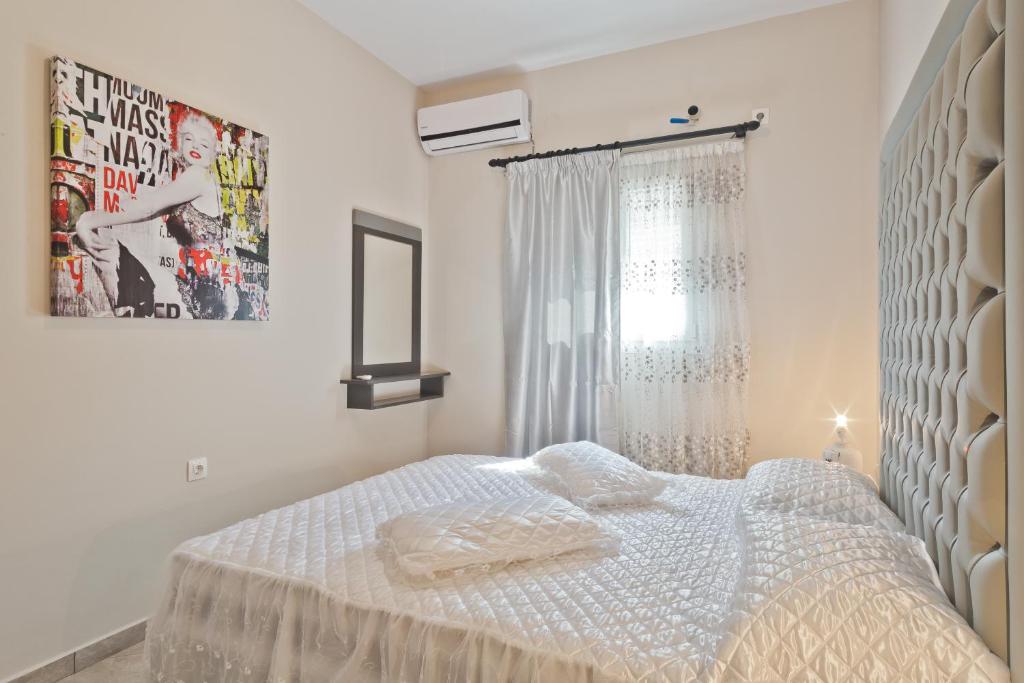 Postel nebo postele na pokoji v ubytování Montemar Studios & Apartments